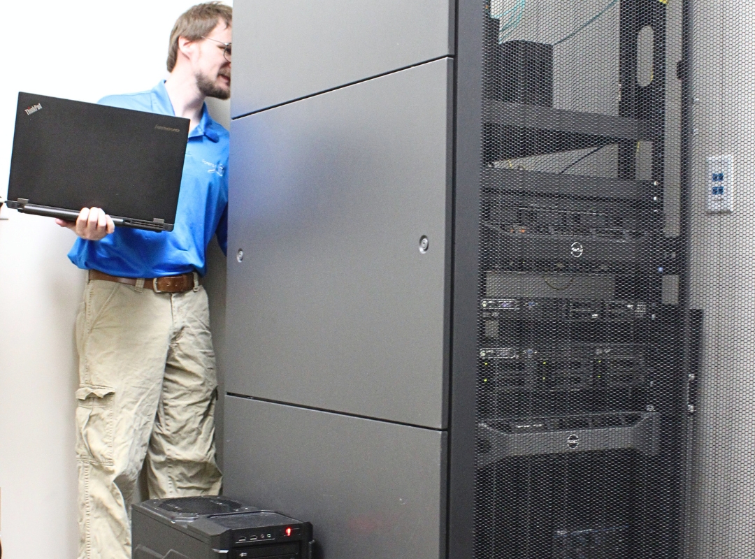 engineer examining server rack