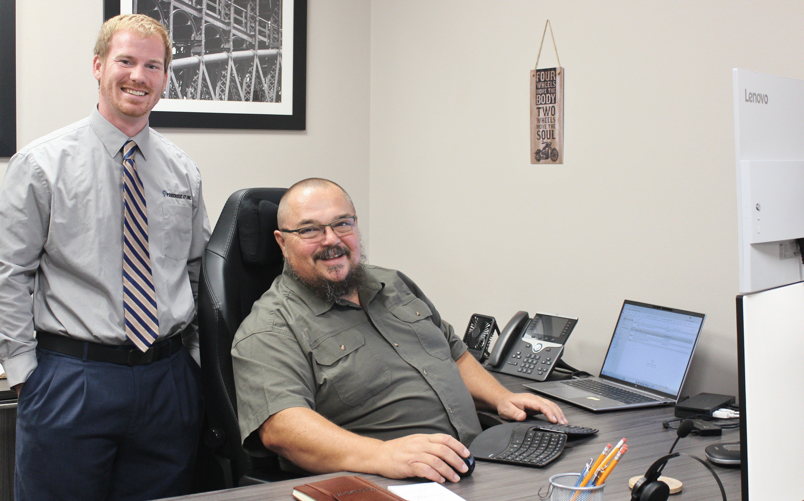 two engineers greeting visitors